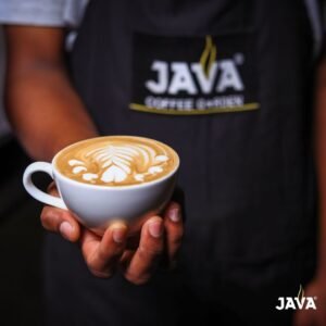 barista holding java Somalia coffee cup